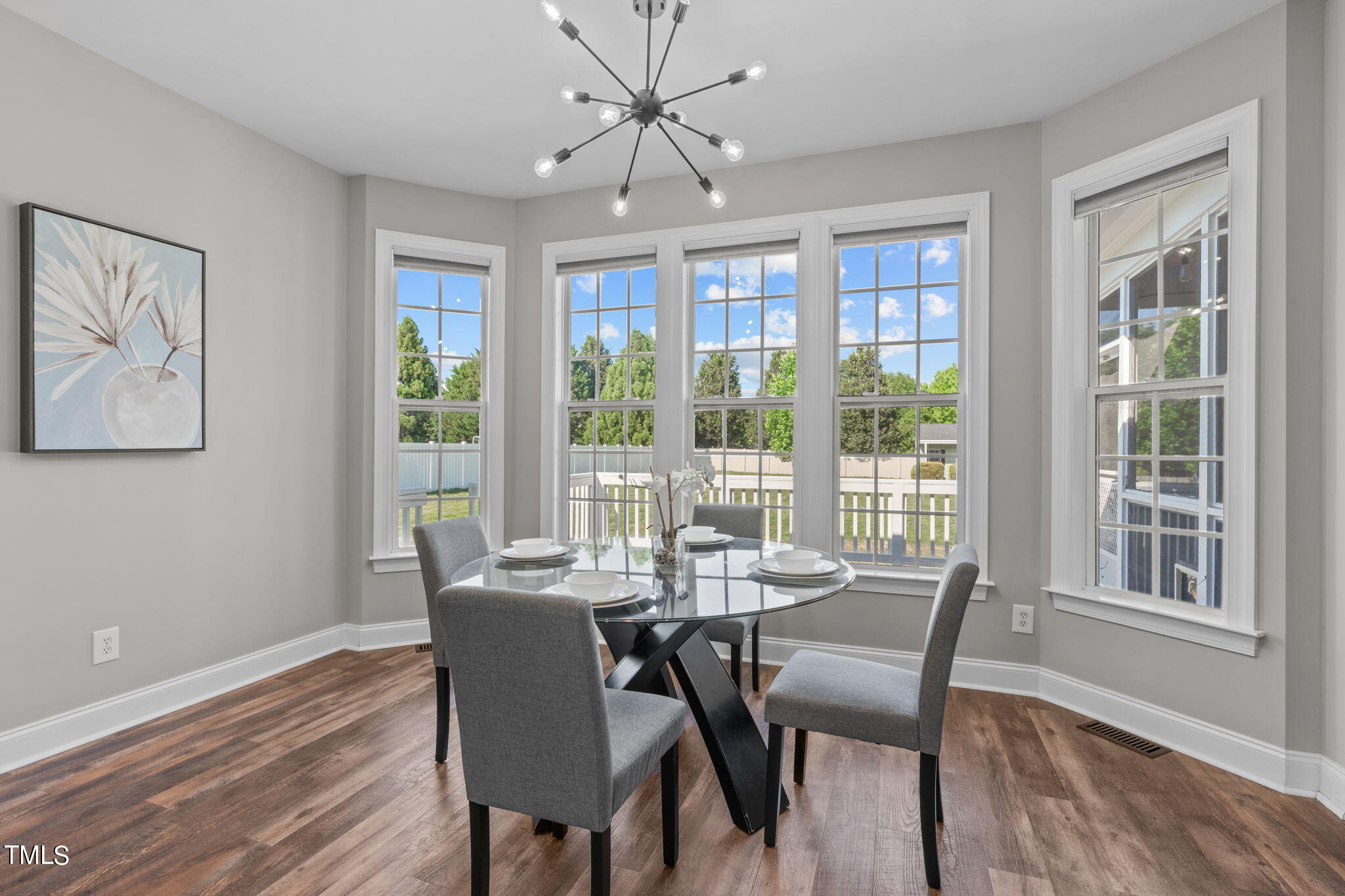 7409 Ladora Drive Willow Spring, NC 27592 - Photo 12 of 33 a view of a dining room with furniture window and wooden floor
