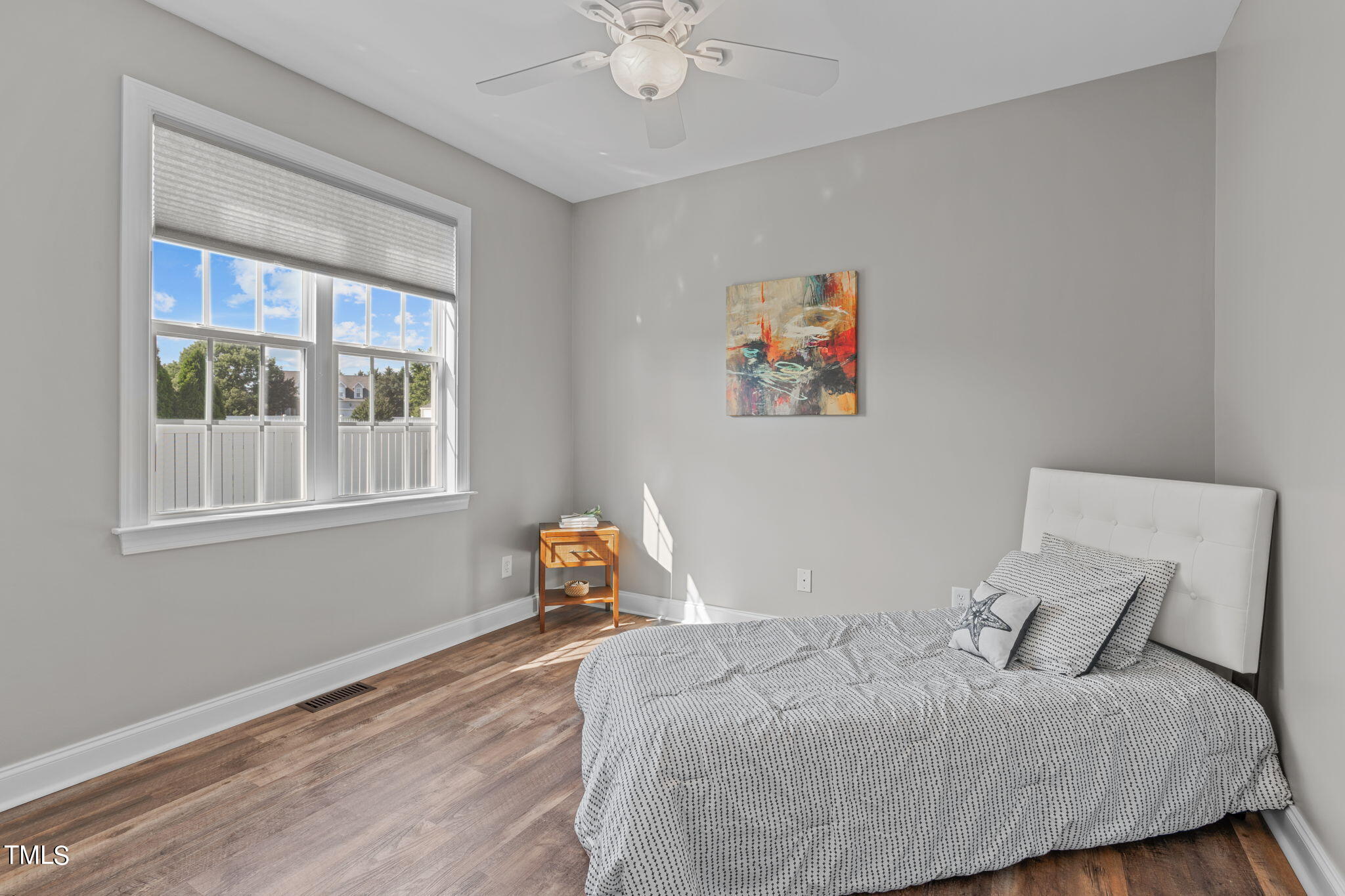 7409 Ladora Drive Willow Spring, NC 27592 - Photo 14 of 33 a bedroom with a bed and a window