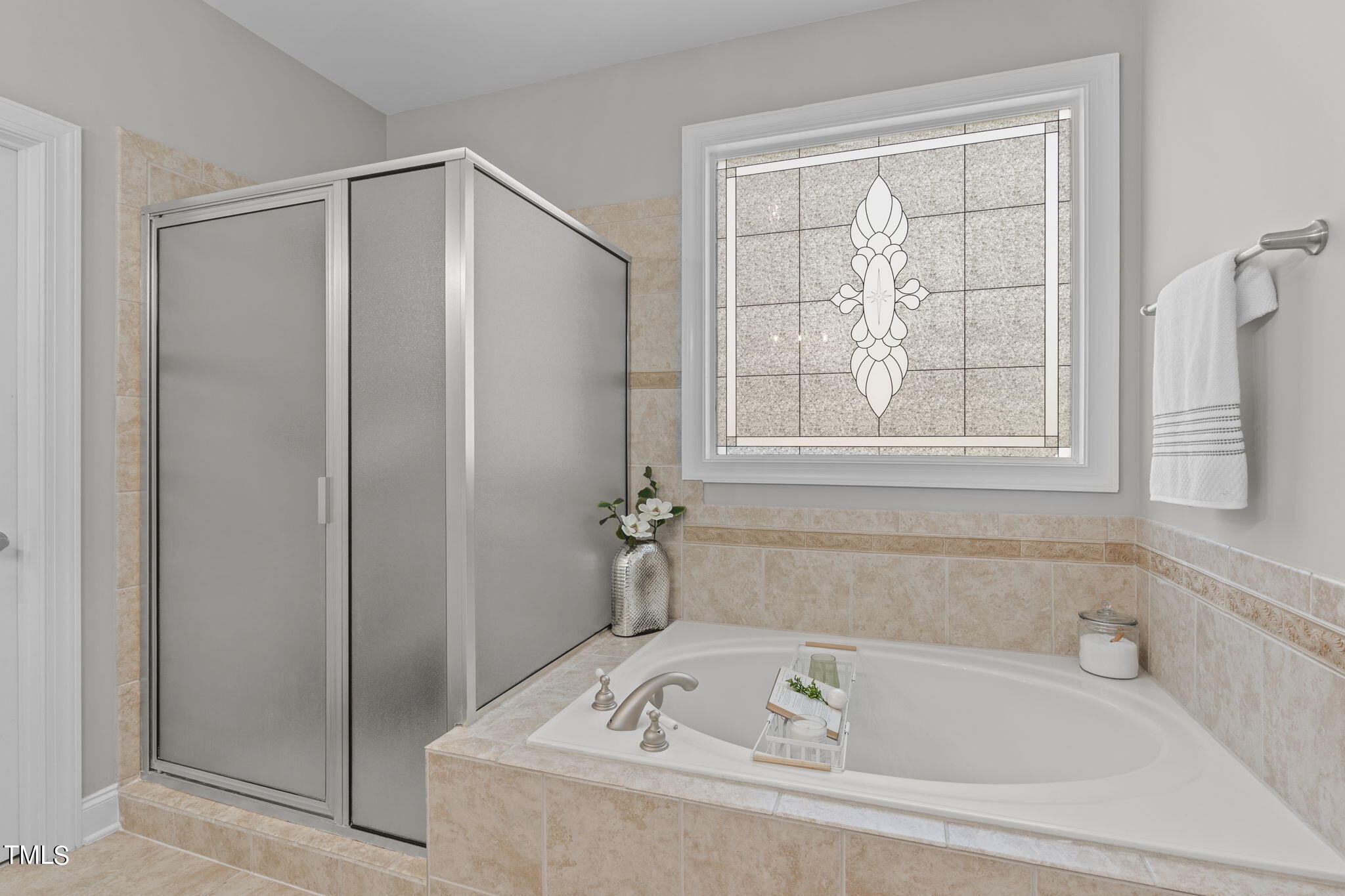 7409 Ladora Drive Willow Spring, NC 27592 - Photo 18 of 33 a white bath tub sitting next to a window