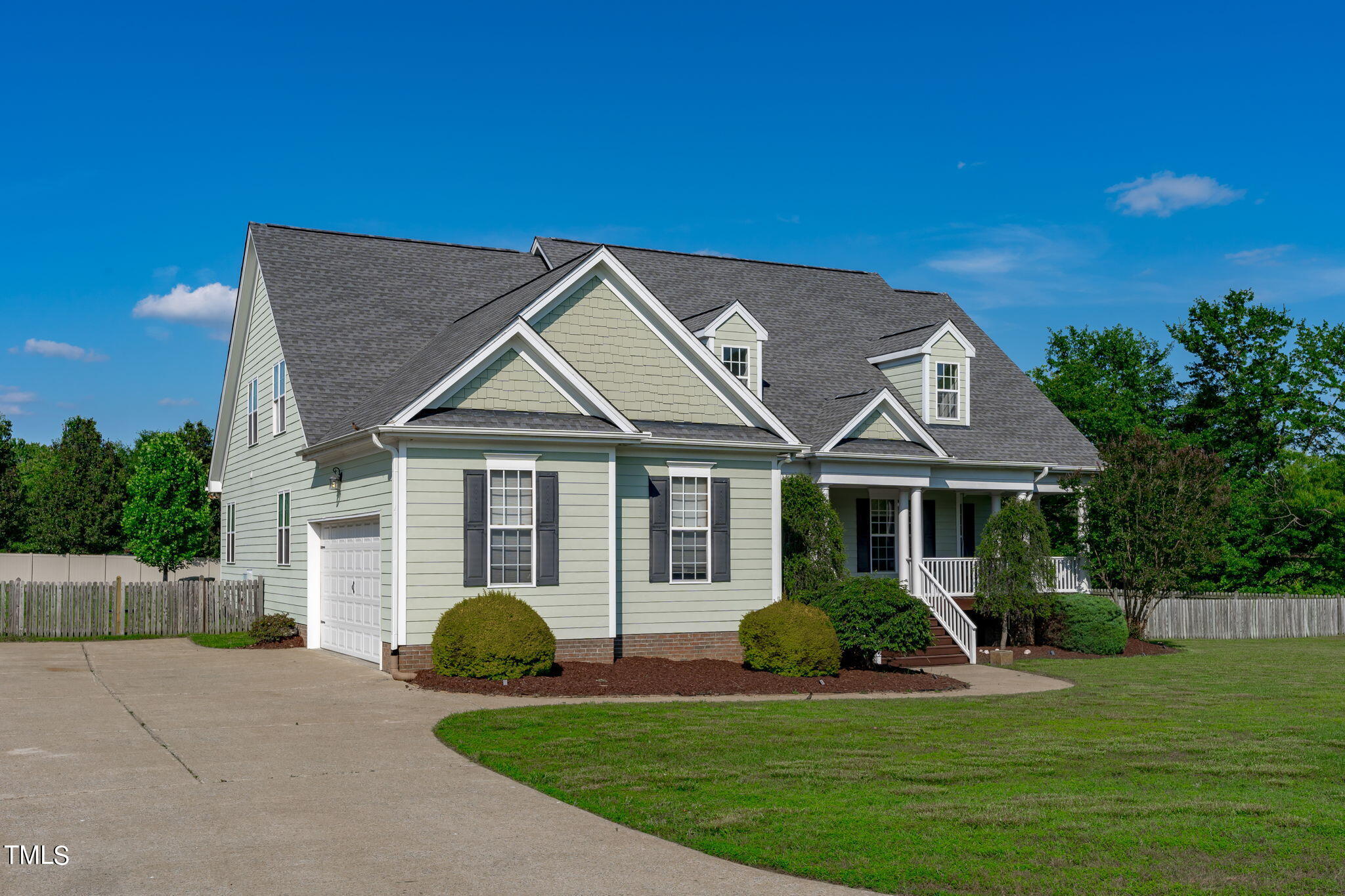 7409 Ladora Drive Willow Spring, NC 27592 - Photo 2 of 33 a front view of a house with a yard