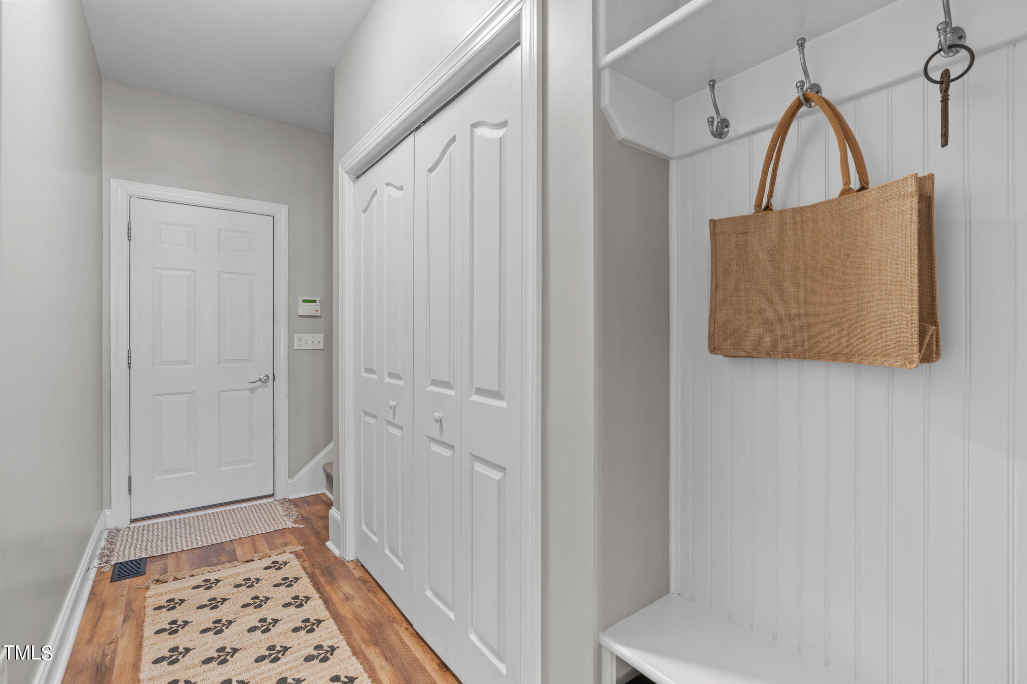 7409 Ladora Drive Willow Spring, NC 27592 - Photo 21 of 33 a view of hallway with wooden floor and a rug