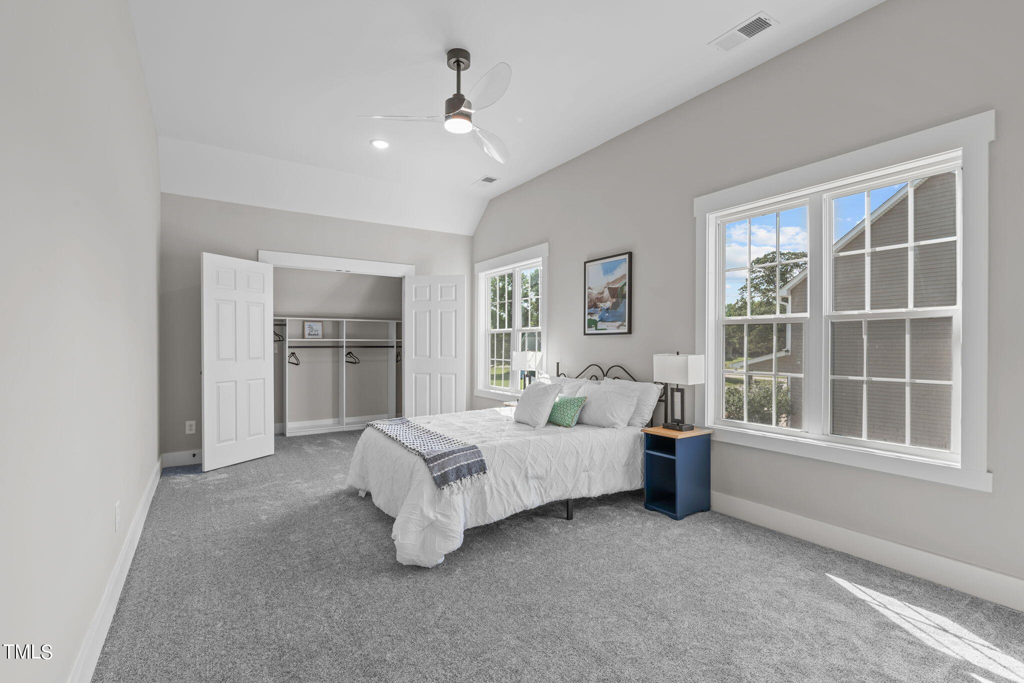 7409 Ladora Drive Willow Spring, NC 27592 - Photo 25 of 33 a spacious bedroom with a bed and a window