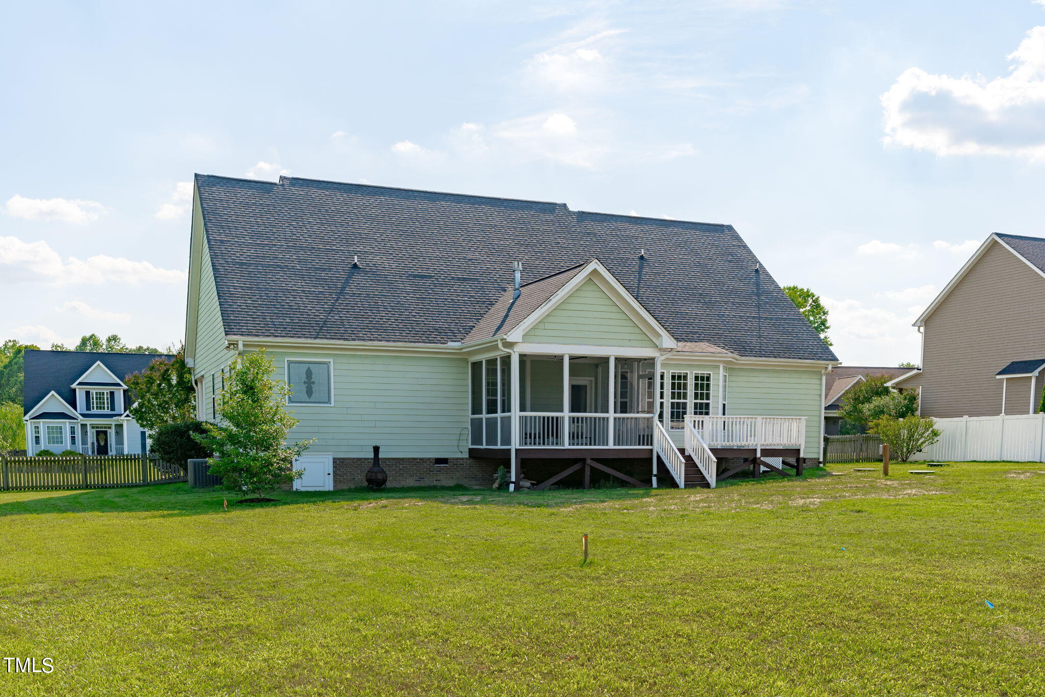 7409 Ladora Drive Willow Spring, NC 27592 - Photo 30 of 33 a front view of a house with garden