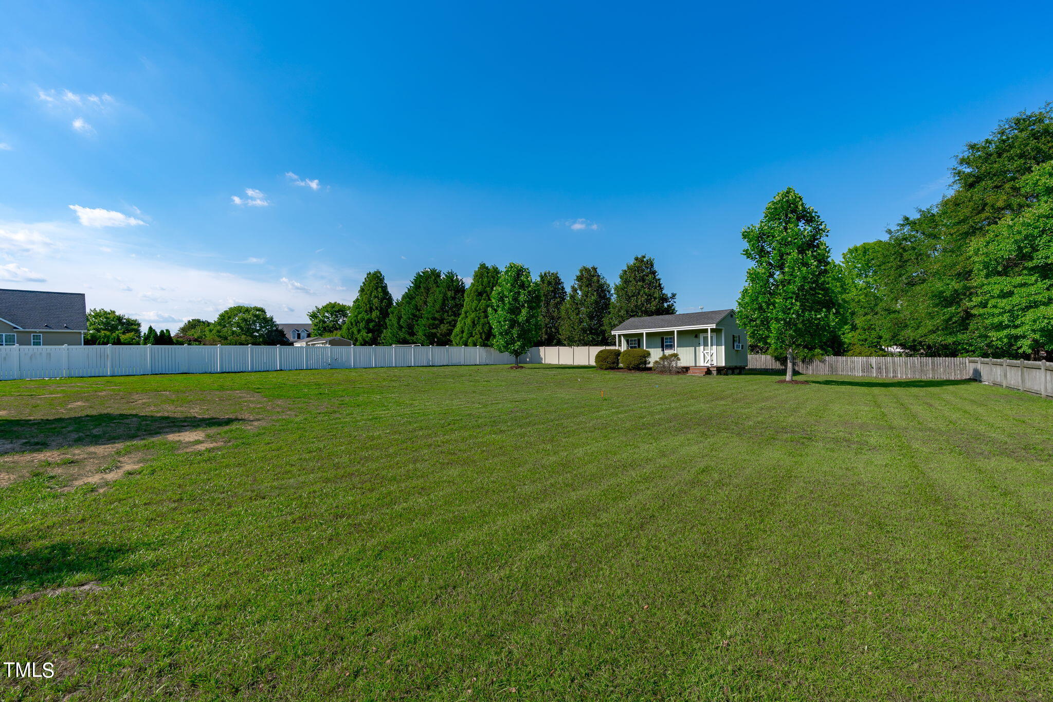 7409 Ladora Drive Willow Spring, NC 27592 - Photo 31 of 33 a view of a field of grass and trees
