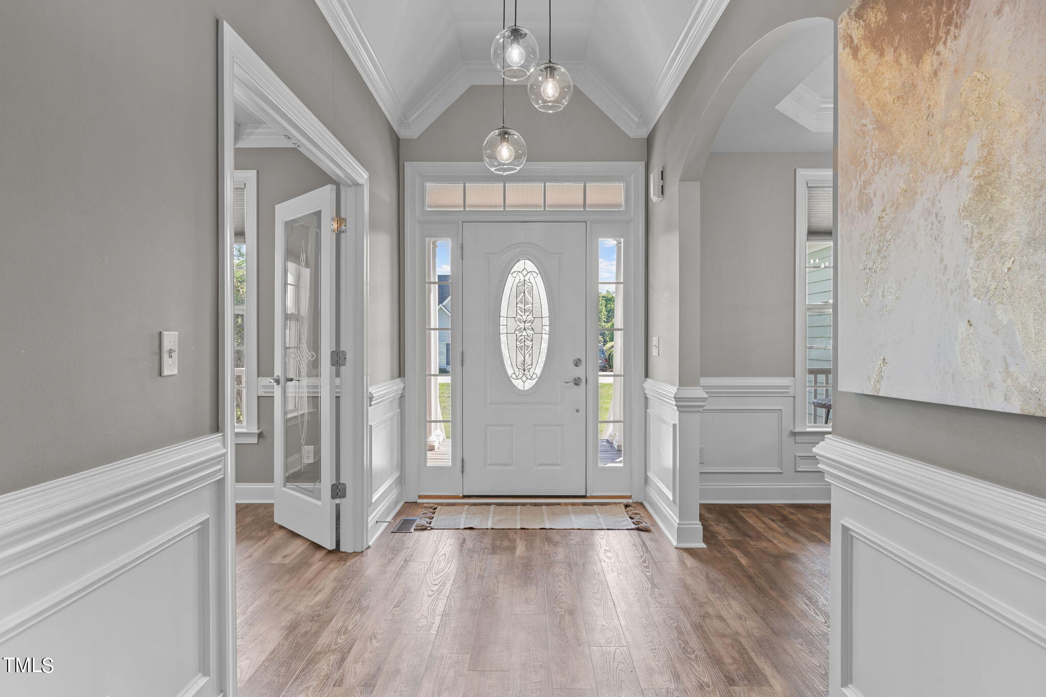 7409 Ladora Drive Willow Spring, NC 27592 - Photo 6 of 33 a view of an entryway with wooden floor