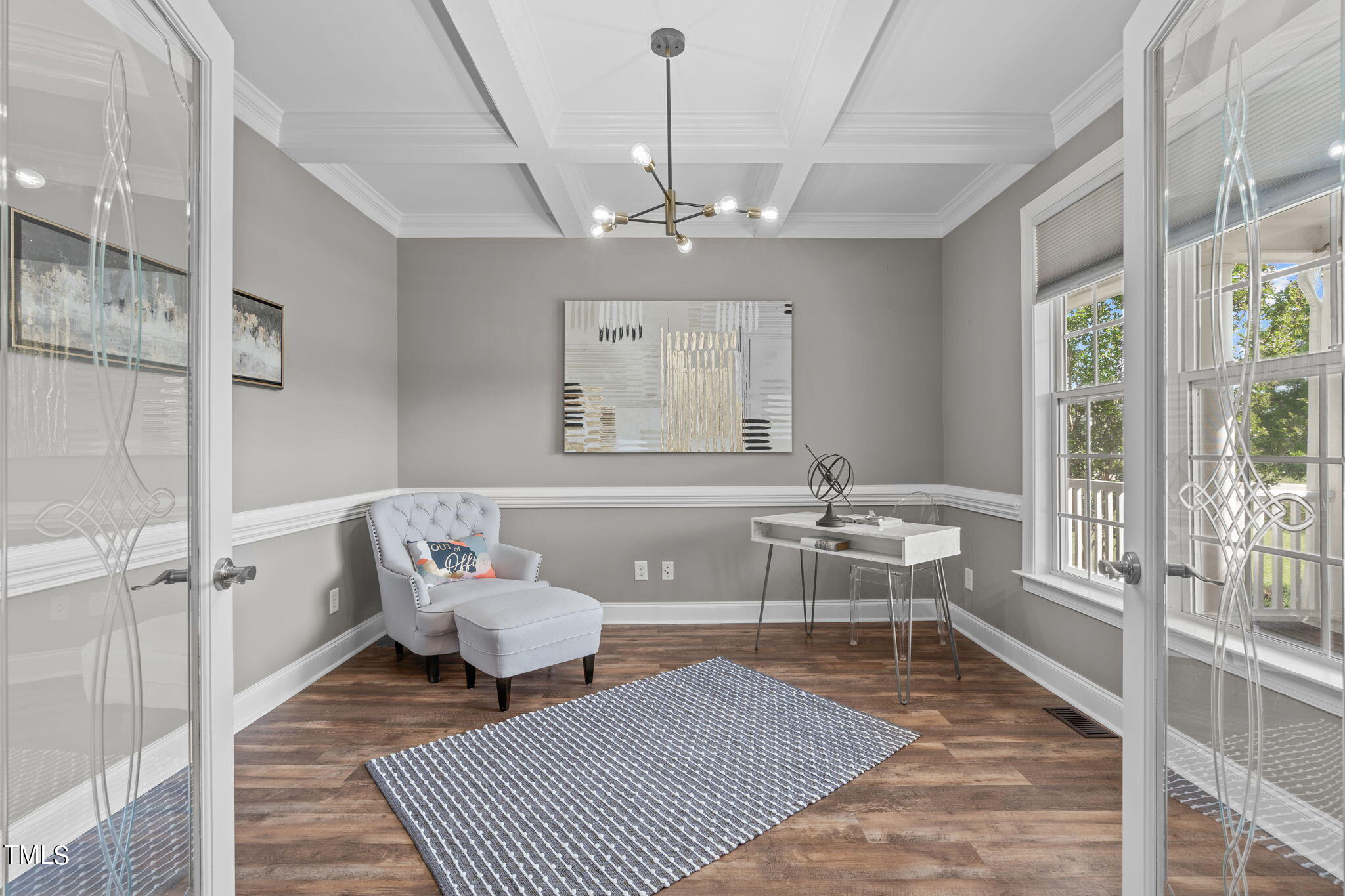 7409 Ladora Drive Willow Spring, NC 27592 - Photo 7 of 33 a living room with furniture and a chandelier