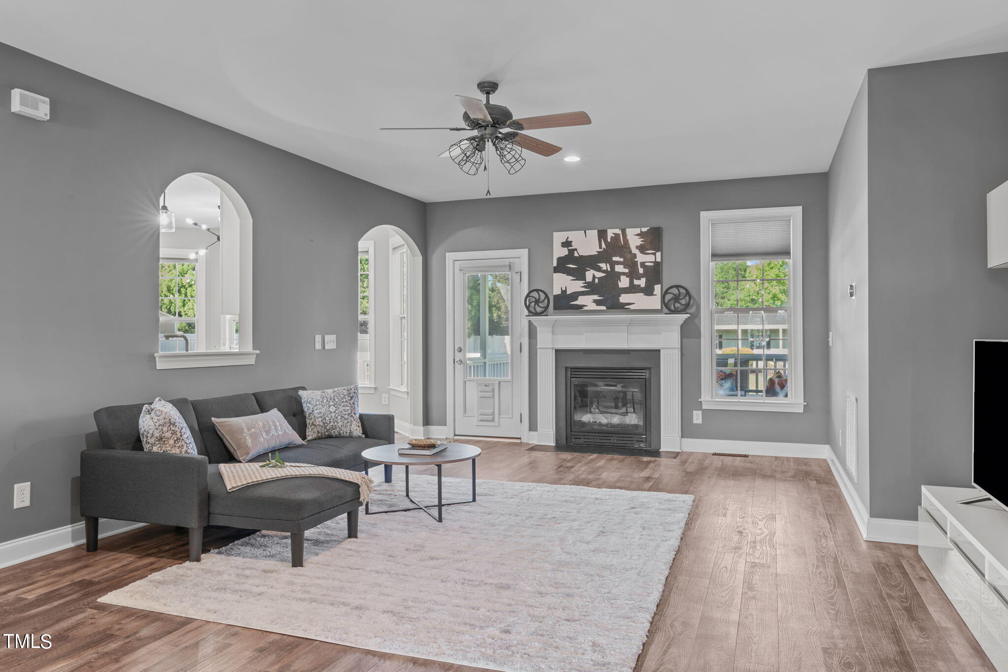 7409 Ladora Drive Willow Spring, NC 27592 - Photo 10 of 33 a living room with furniture and a fireplace