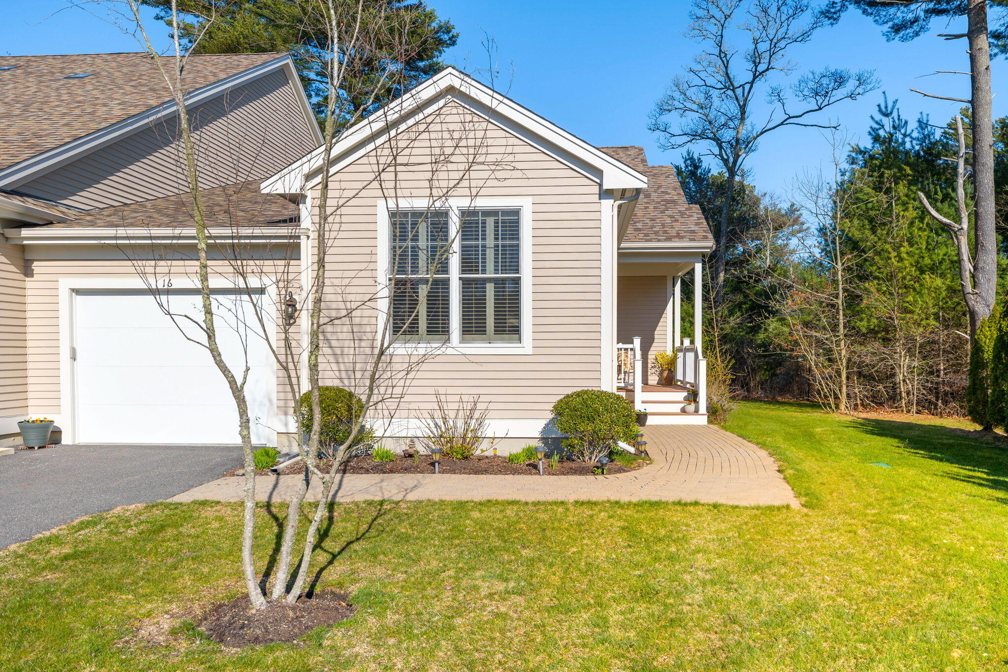 16 Grey Hawk Drive, Unit 16 Mashpee, MA 02649 - Photo 1 of 29 a front view of a house with a yard