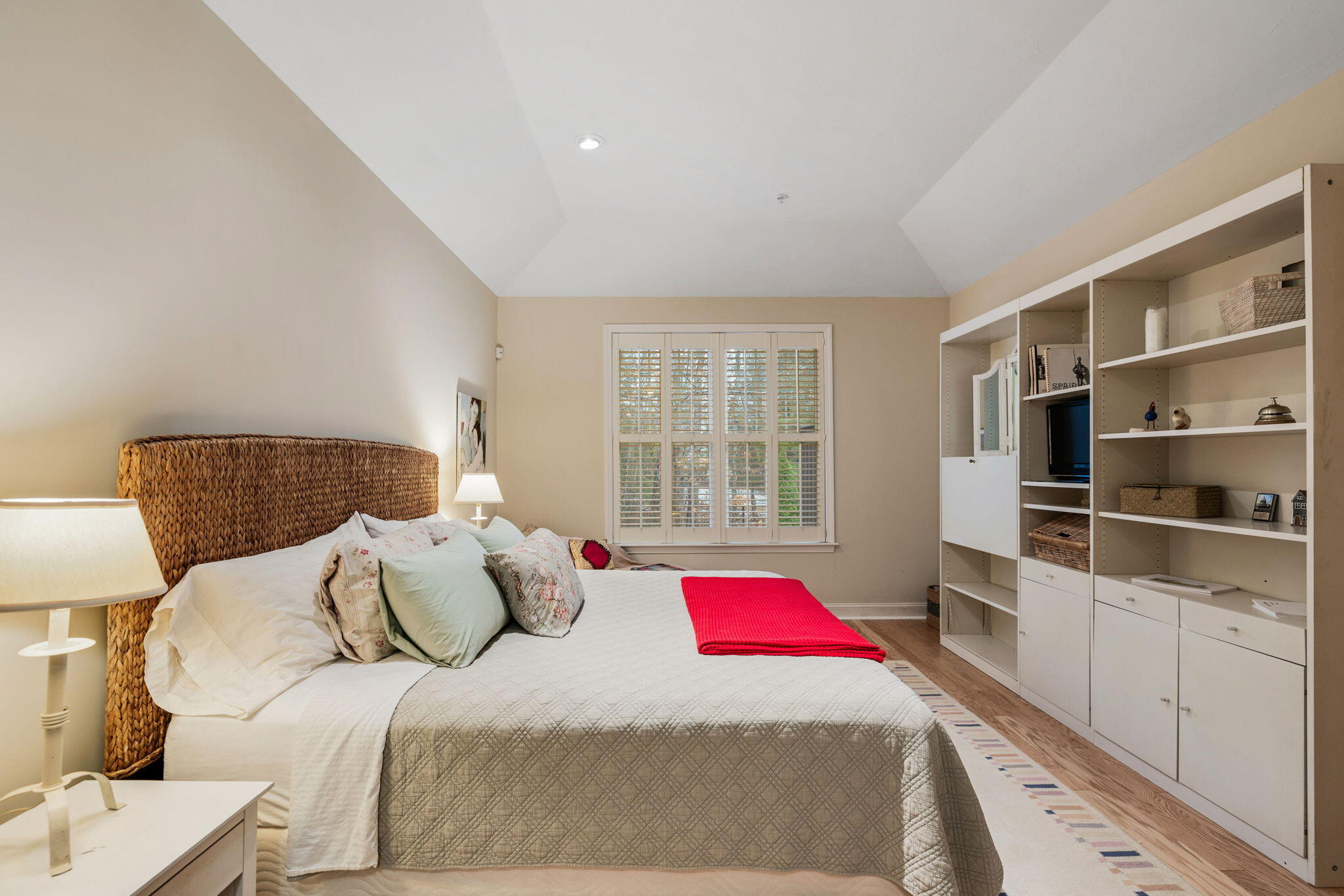 16 Grey Hawk Drive, Unit 16 Mashpee, MA 02649 - Photo 14 of 29 a bedroom with a bed and wooden floor