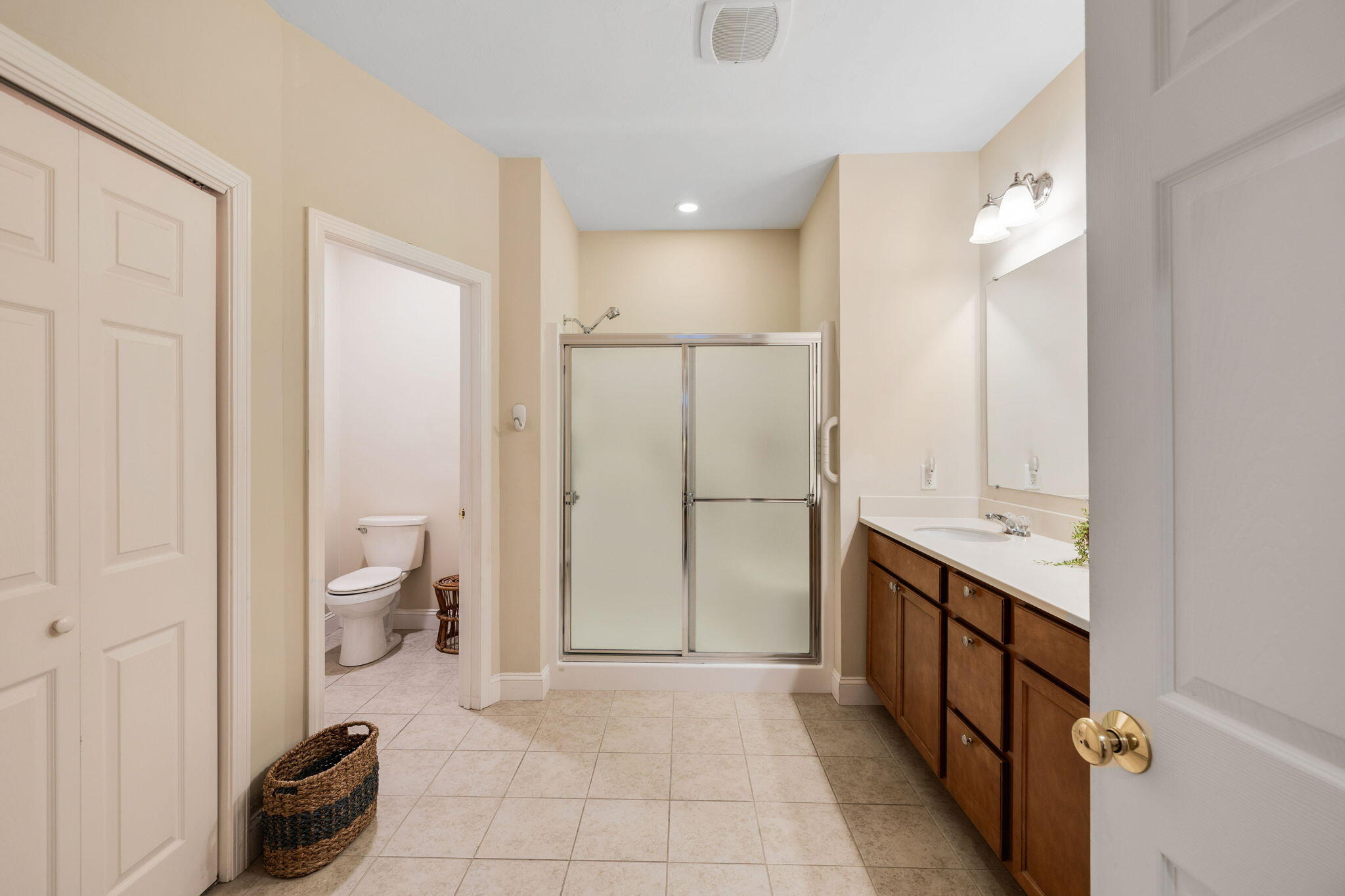 16 Grey Hawk Drive, Unit 16 Mashpee, MA 02649 - Photo 20 of 29 a bathroom with a double vanity sink toilet and shower