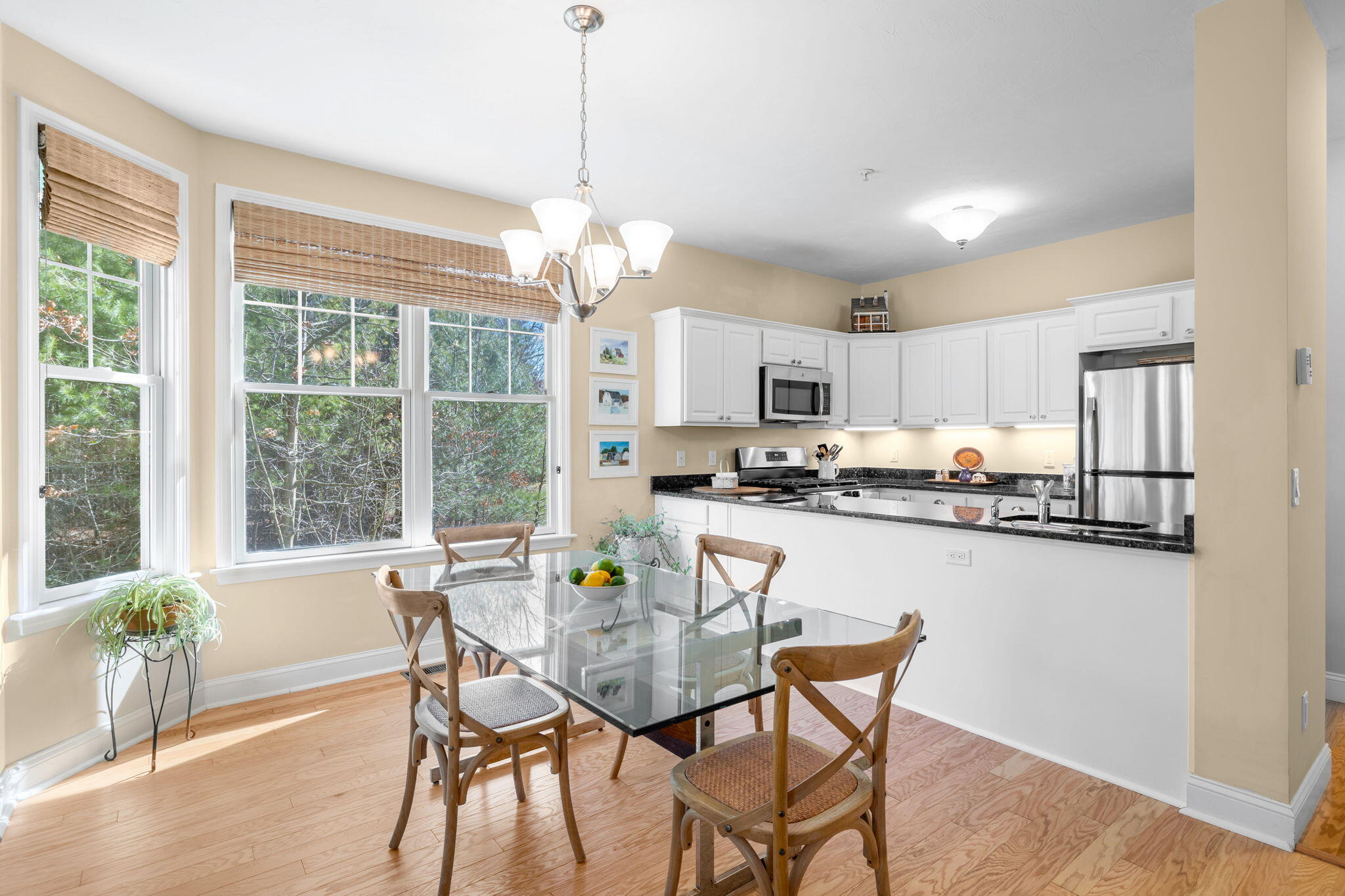 16 Grey Hawk Drive, Unit 16 Mashpee, MA 02649 - Photo 5 of 29 a dining room with stainless steel appliances granite countertop a dining table chairs and a glass top table