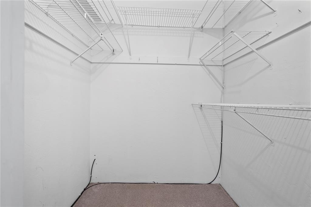 303 Ridge Boulevard, Unit 110 South Daytona, FL 32119 - Photo 12 of 33 a view of a utility room with racks on the wall