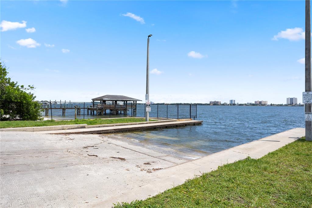 303 Ridge Boulevard, Unit 110 South Daytona, FL 32119 - Photo 28 of 33 a view of a swimming pool with an outdoor space and seating area