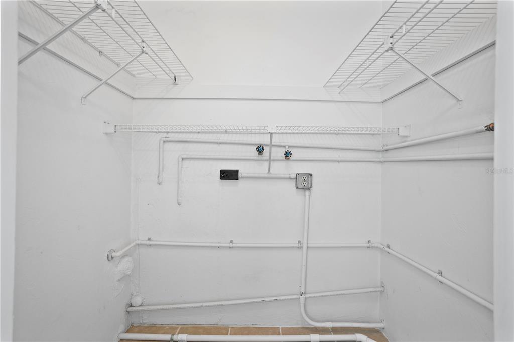 303 Ridge Boulevard, Unit 110 South Daytona, FL 32119 - Photo 9 of 33 a view of a room with racks on the wall