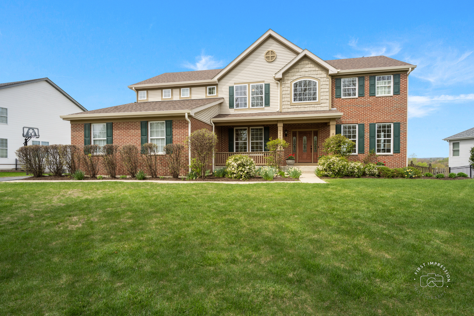 334 Willowbrook Way Geneva, IL 60134 - Photo 1 of 34 a front view of a house with garden