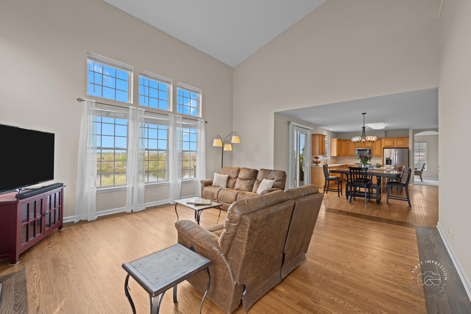 334 Willowbrook Way Geneva, IL 60134 - Photo 13 of 34 a living room with furniture and a flat screen tv