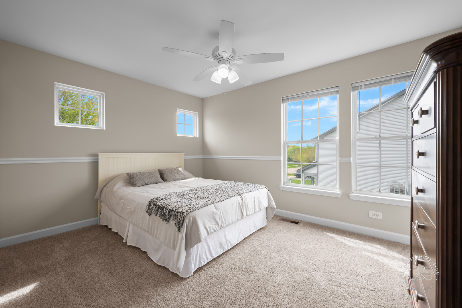 334 Willowbrook Way Geneva, IL 60134 - Photo 17 of 34 a spacious bedroom with a bed and a window