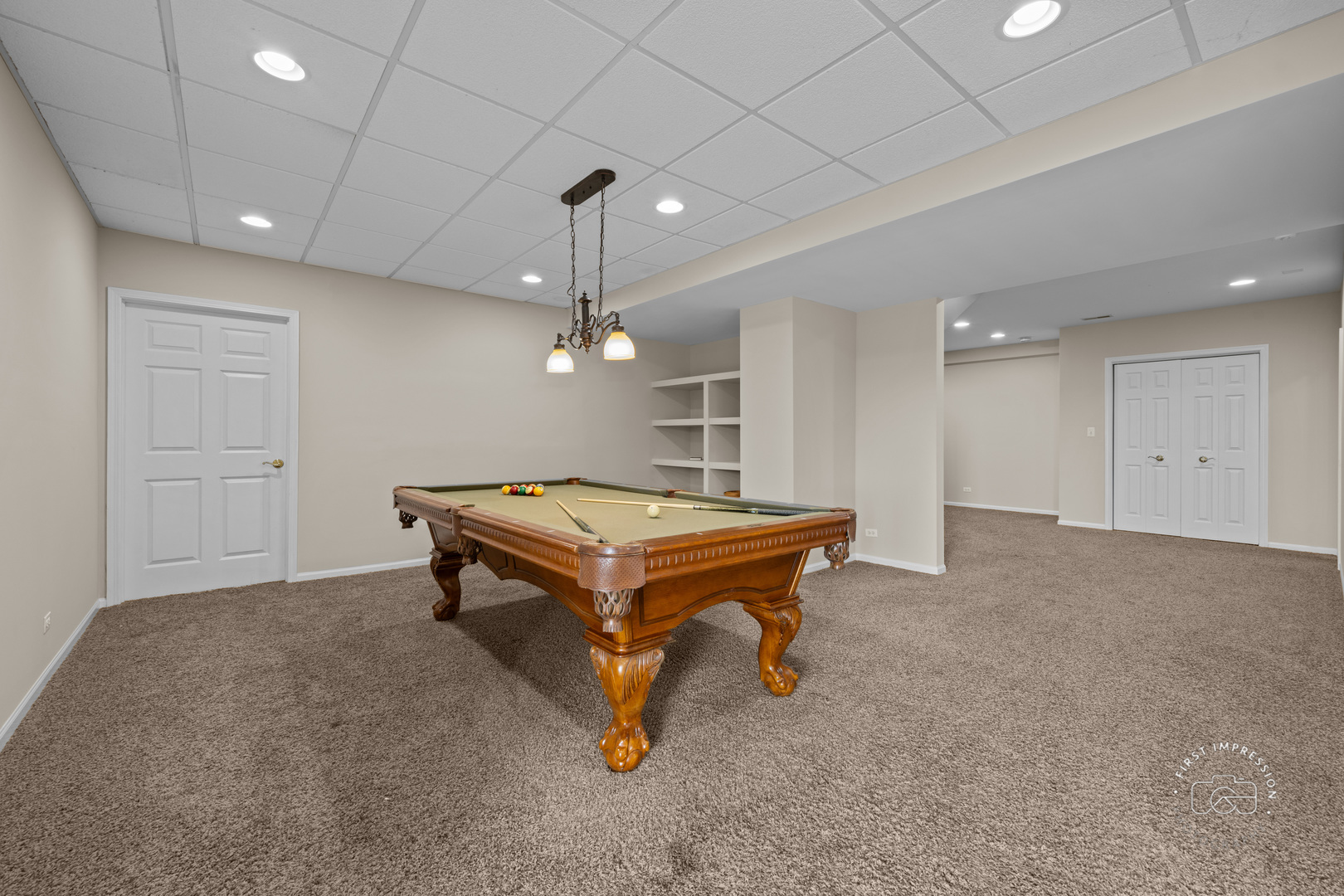 334 Willowbrook Way Geneva, IL 60134 - Photo 22 of 34 a room with pool tables and a chandelier
