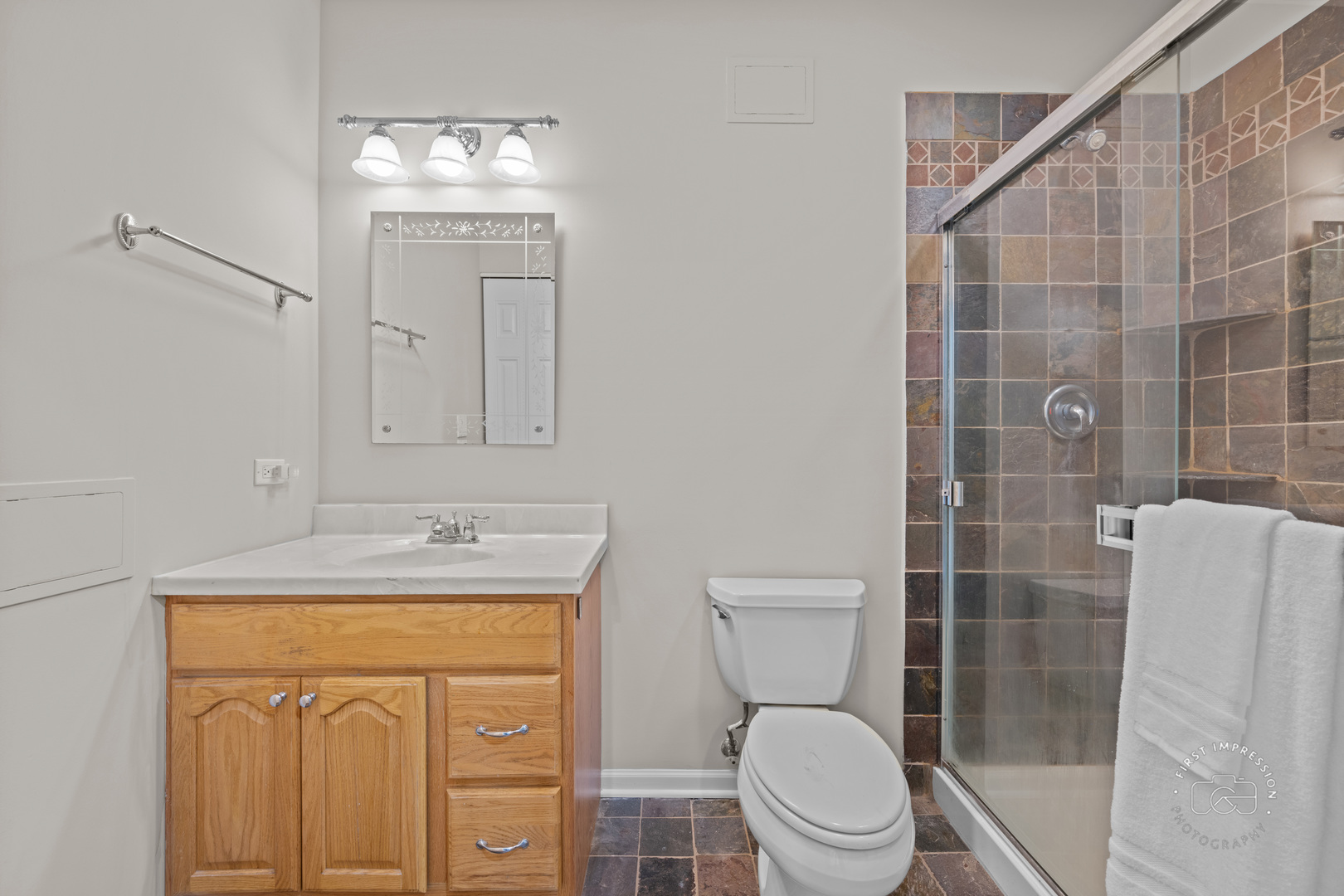 334 Willowbrook Way Geneva, IL 60134 - Photo 24 of 34 a bathroom with a granite countertop toilet sink and mirror