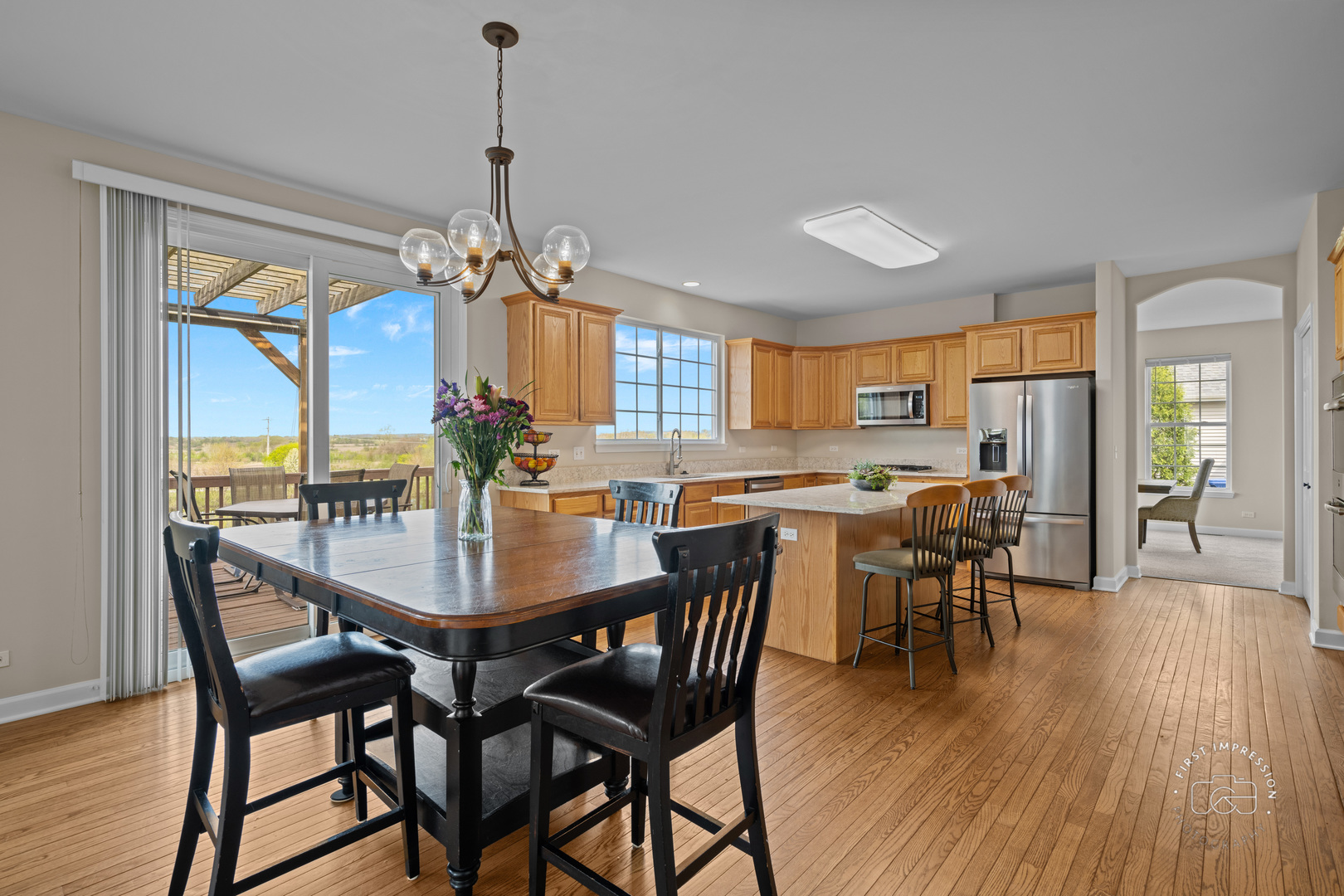 334 Willowbrook Way Geneva, IL 60134 - Photo 9 of 34 a view of a dining room with furniture window and wooden floor