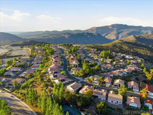 an aerial view of residential house and sandy dunes