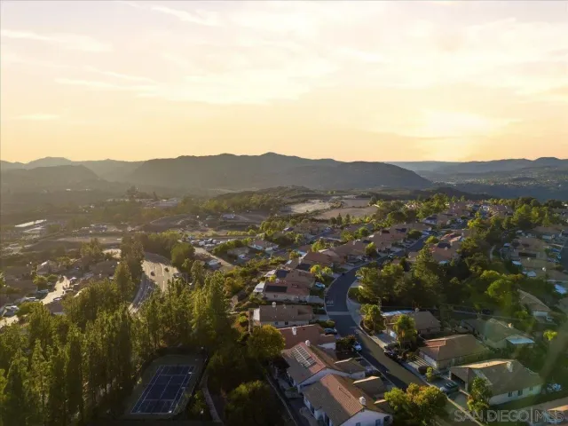 an aerial view of residential house and green space