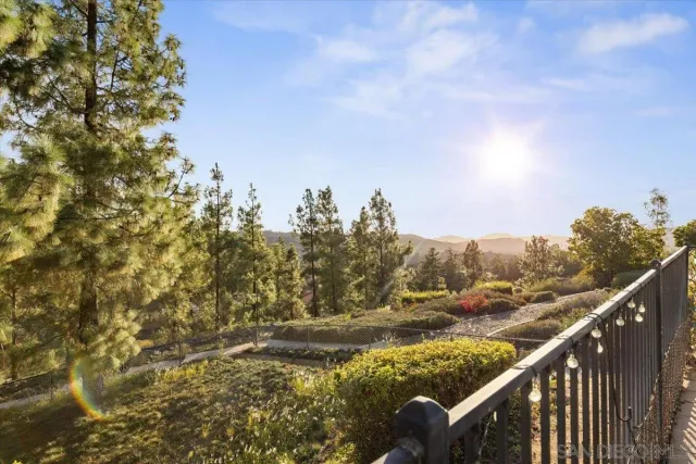 a view of a balcony with an outdoor space and seating area