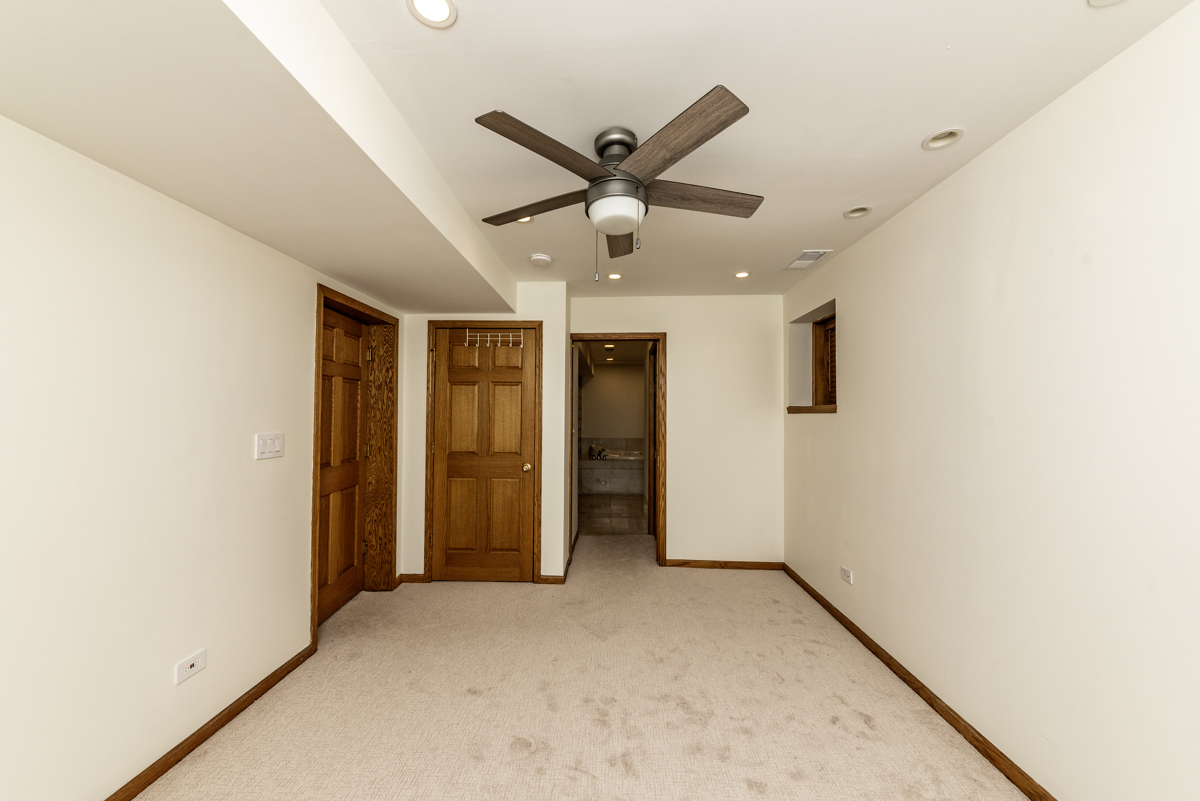 4625 North Dover Street, Unit G Chicago, IL 60640 - Photo 14 of 26 a view of a livingroom with a ceiling fan and window