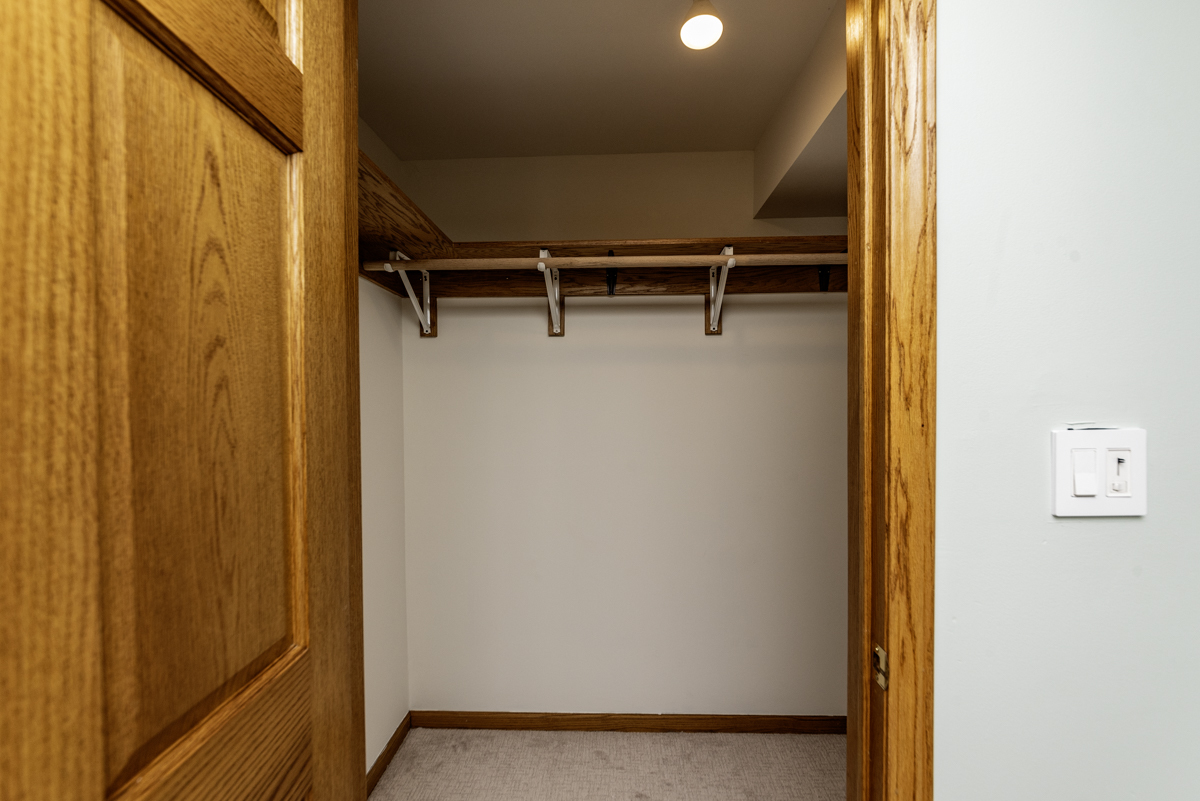 4625 North Dover Street, Unit G Chicago, IL 60640 - Photo 15 of 26 a view of walk in closet with empty racks