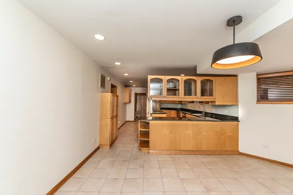 a view of a kitchen with wooden floor