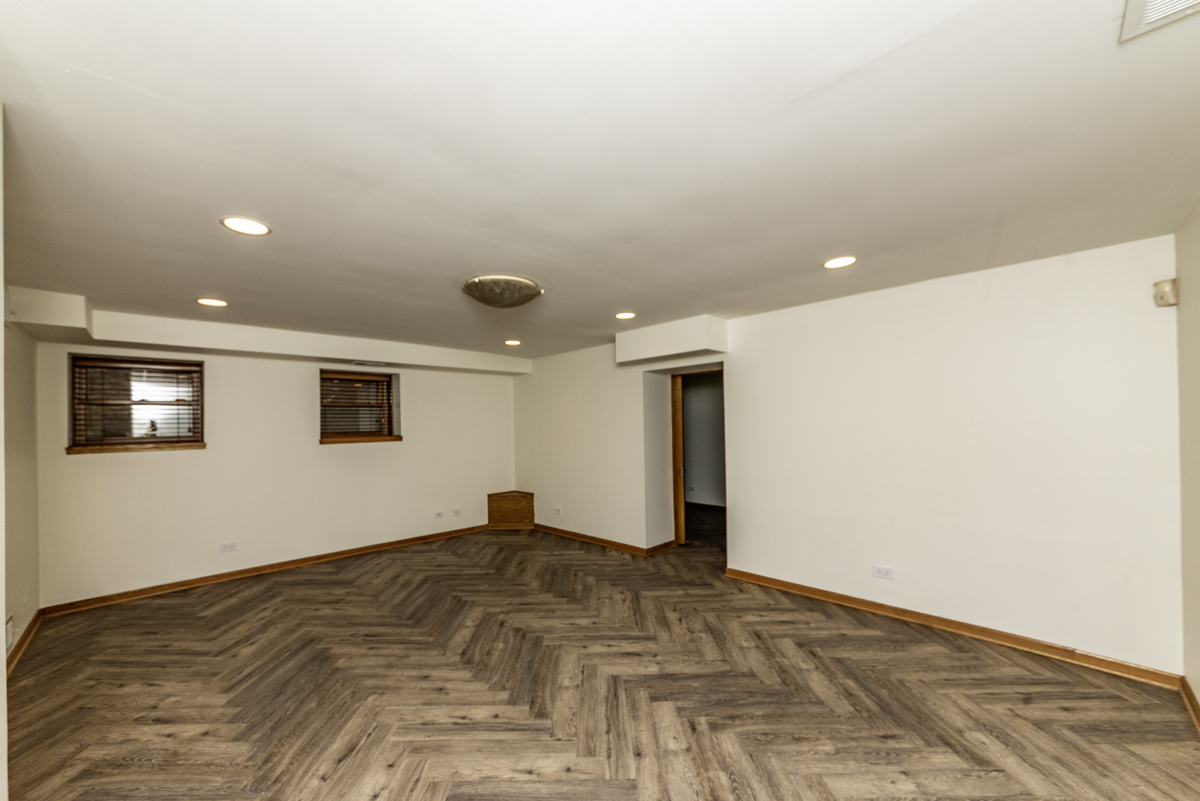 4625 North Dover Street, Unit G Chicago, IL 60640 - Photo 6 of 26 a view of empty room with wooden floor