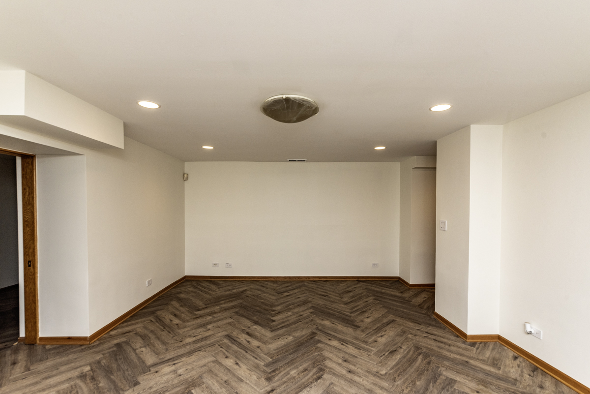 4625 North Dover Street, Unit G Chicago, IL 60640 - Photo 7 of 26 a view of a room has wooden floor and fan