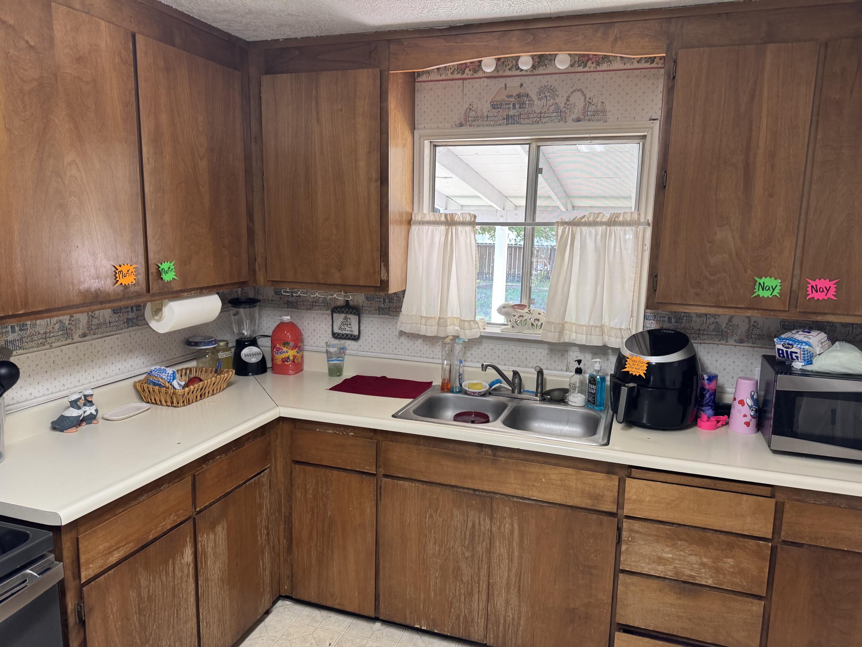 1015 Gold Street Redding, CA 96001 - Photo 16 of 17 a kitchen with a sink cabinets and window