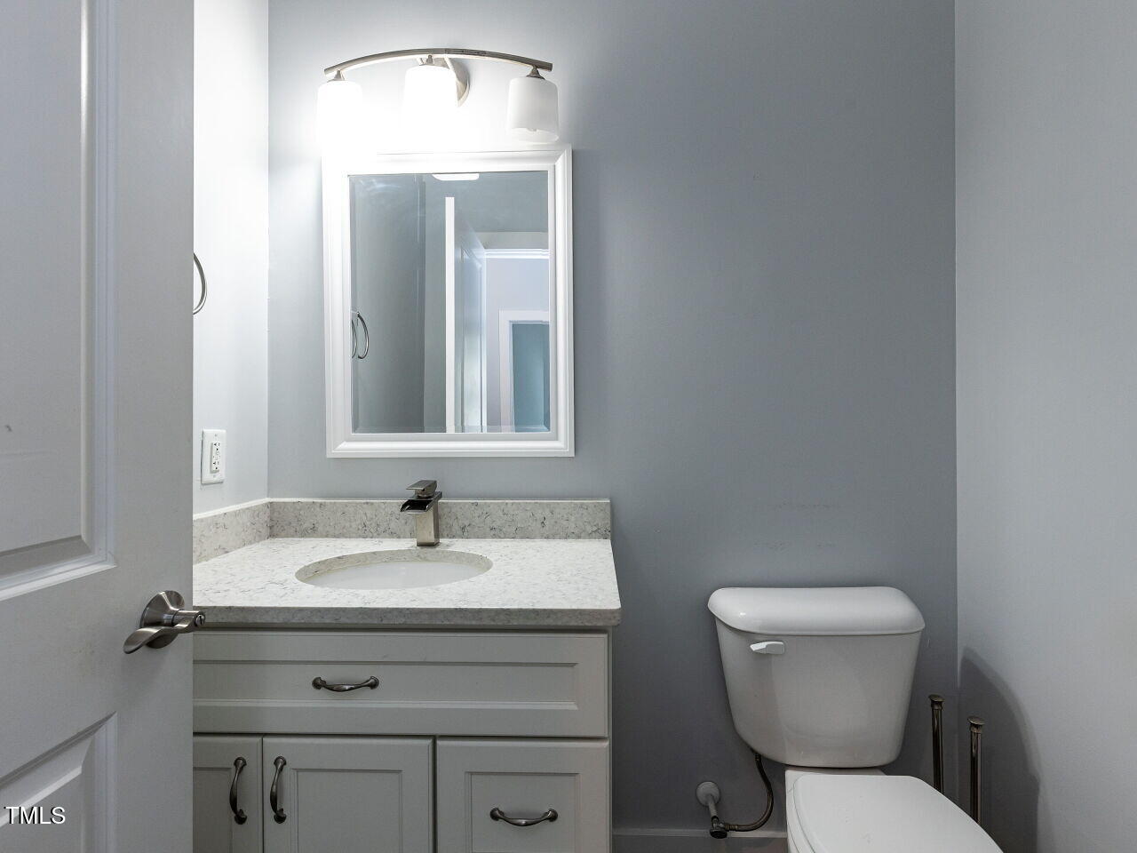 314 Gray Avenue Durham, NC 27701 - Photo 12 of 30 a bathroom with a sink toilet and mirror