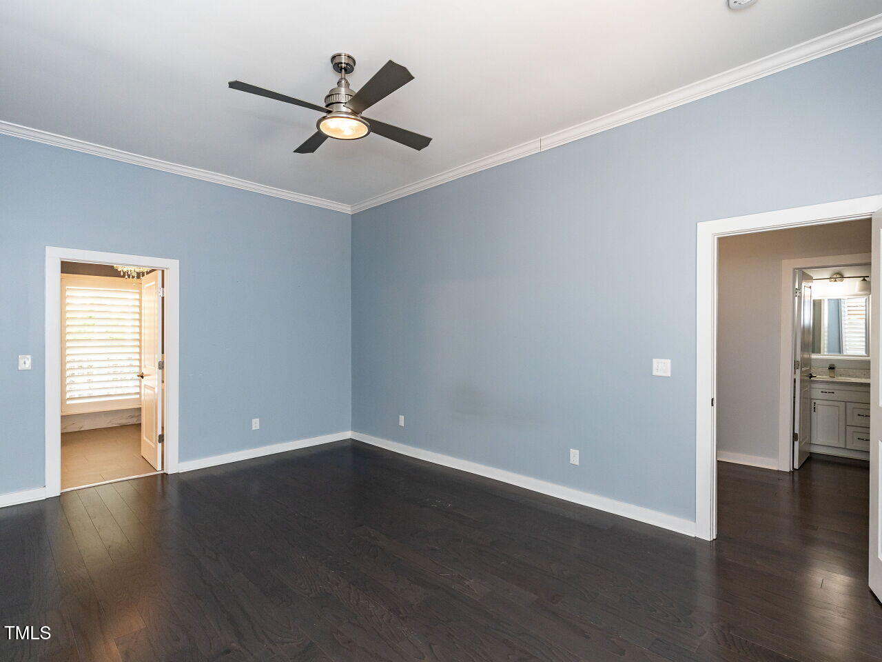 314 Gray Avenue Durham, NC 27701 - Photo 14 of 30 a view of an empty room with wooden floor and a ceiling fan