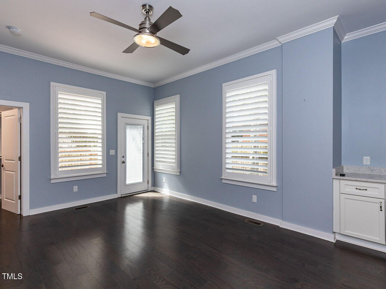 314 Gray Avenue Durham, NC 27701 - Photo 15 of 30 a view of an empty room with wooden floor and a window