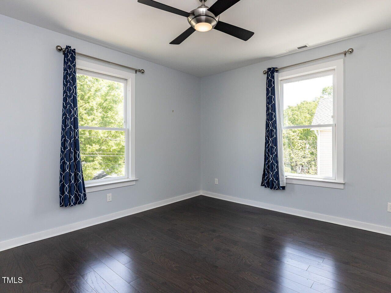 314 Gray Avenue Durham, NC 27701 - Photo 19 of 30 a view of an empty room with wooden floor and a window