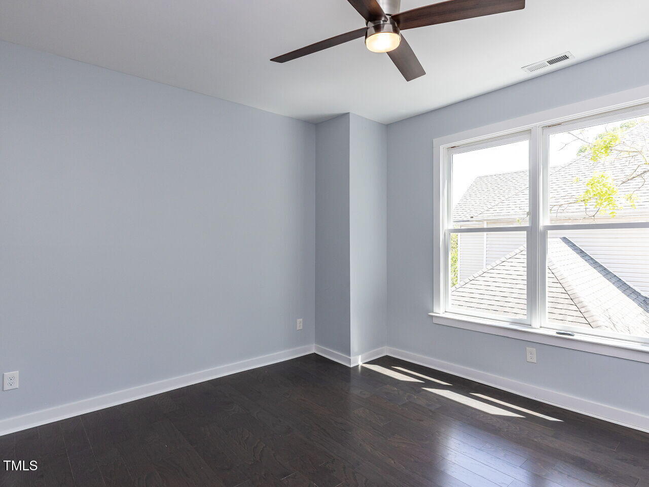 314 Gray Avenue Durham, NC 27701 - Photo 21 of 30 an empty room with wooden floor and windows