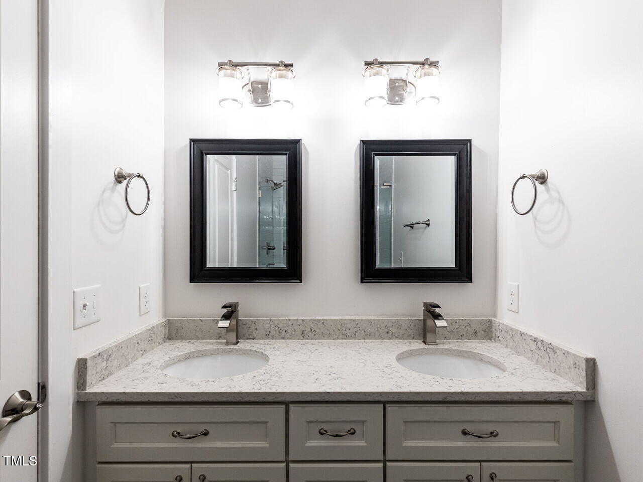 314 Gray Avenue Durham, NC 27701 - Photo 23 of 30 a bathroom with double sink and a mirror