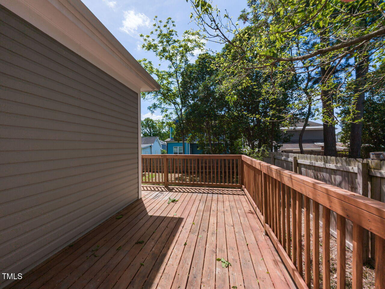 314 Gray Avenue Durham, NC 27701 - Photo 26 of 30 a view of balcony with wooden floor and trees