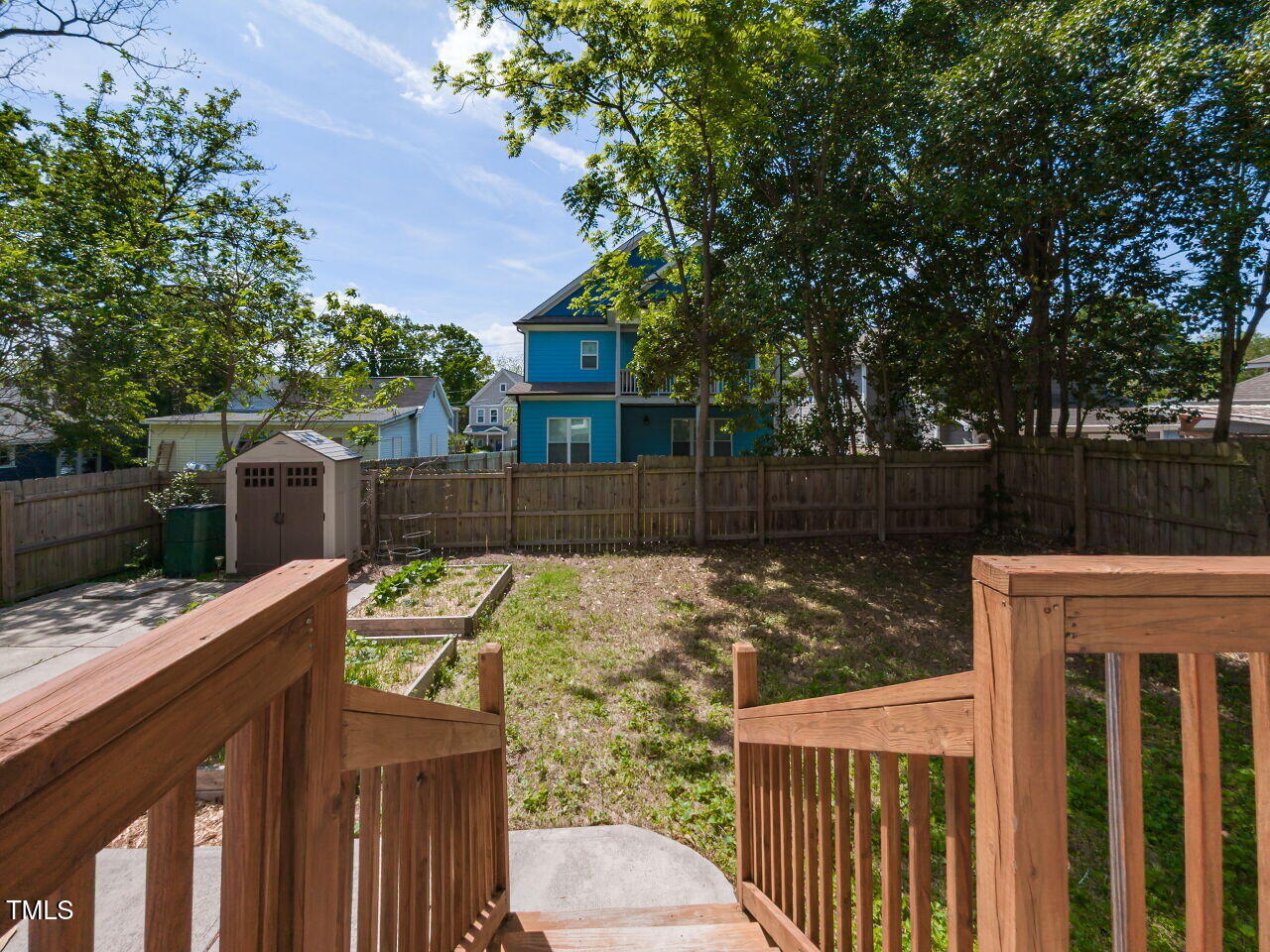 314 Gray Avenue Durham, NC 27701 - Photo 27 of 30 a view of a wooden fence and trees around