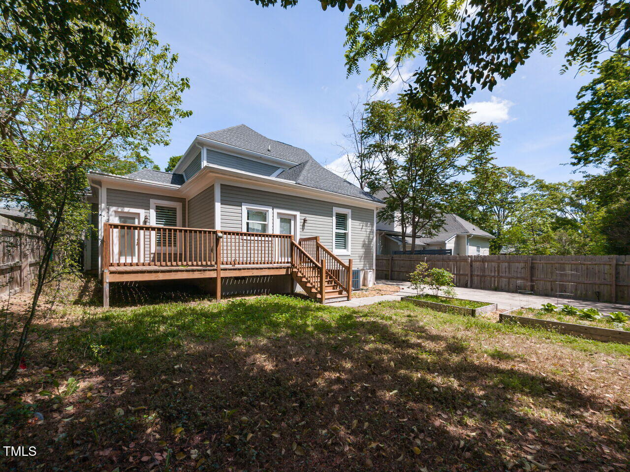 314 Gray Avenue Durham, NC 27701 - Photo 30 of 30 a view of a house with backyard and a tree