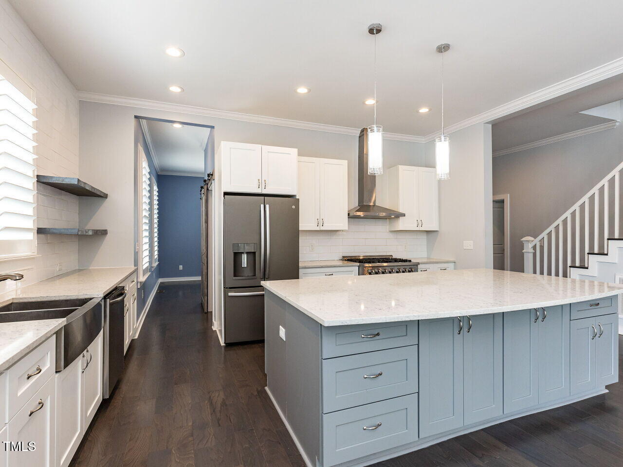 314 Gray Avenue Durham, NC 27701 - Photo 8 of 30 a kitchen with a stove a refrigerator and a sink