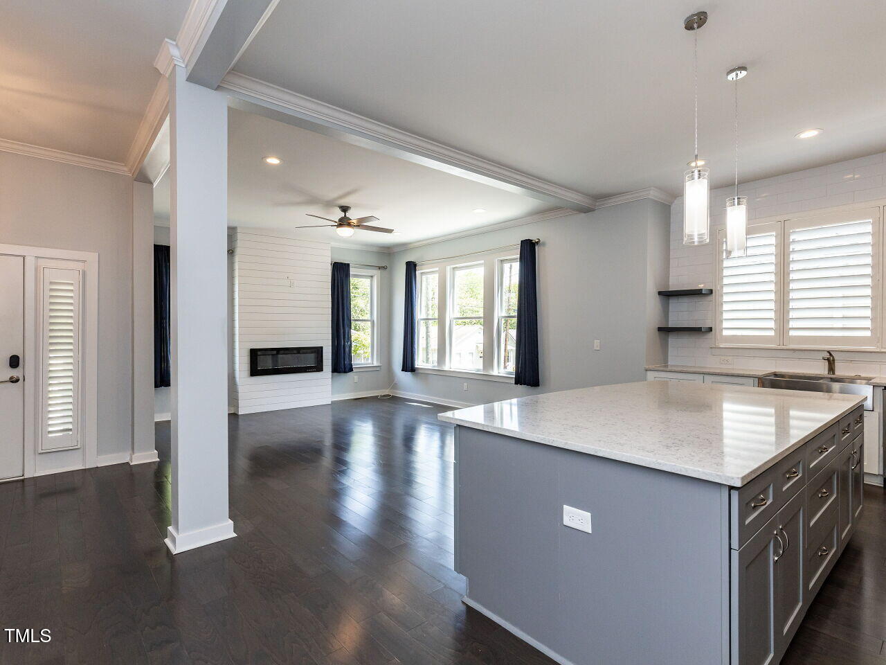 314 Gray Avenue Durham, NC 27701 - Photo 9 of 30 a kitchen with stainless steel appliances granite countertop a sink a stove and a refrigerator