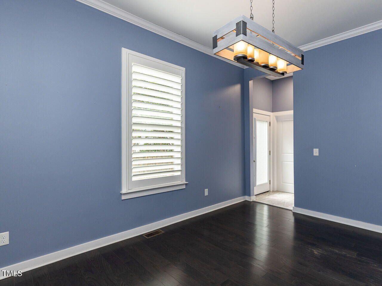 314 Gray Avenue Durham, NC 27701 - Photo 10 of 30 an empty room with wooden floor and windows