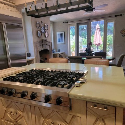 a dining room with furniture a rug and wooden floor