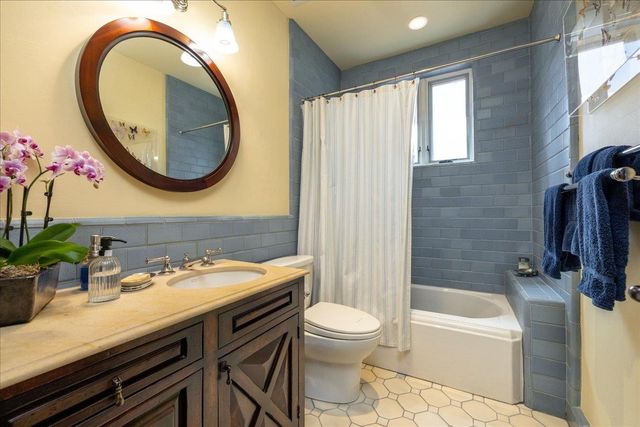 a bedroom with a bed and a fireplace