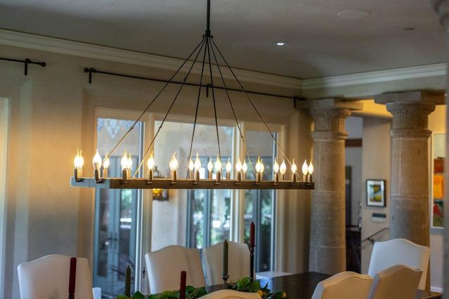 a living room with furniture a fireplace and a table