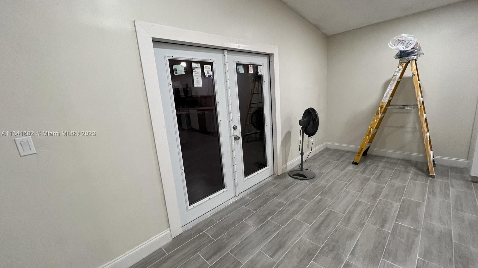 Sunset Miami, FL 33173 - Photo 20 of 41 a view of a hallway with wooden floor and staircase