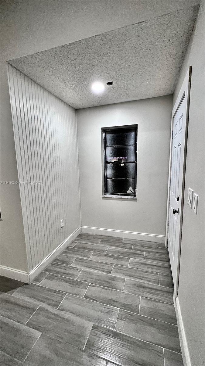 Sunset Miami, FL 33173 - Photo 2 of 41 a view of empty room with wooden floor and fan